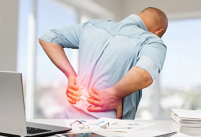 Business man with back pain an office