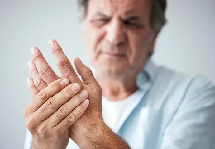 Old man with finger pain