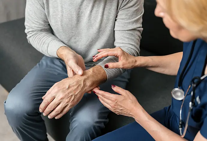 Doctor visits senior man at home for health consultation and treatment