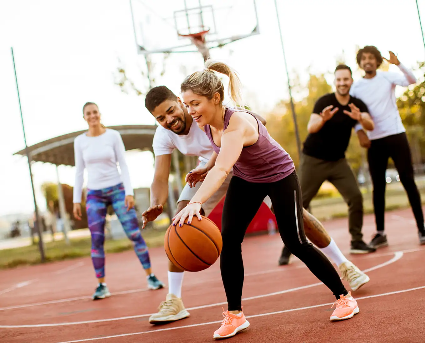 group of friends playing basketball
