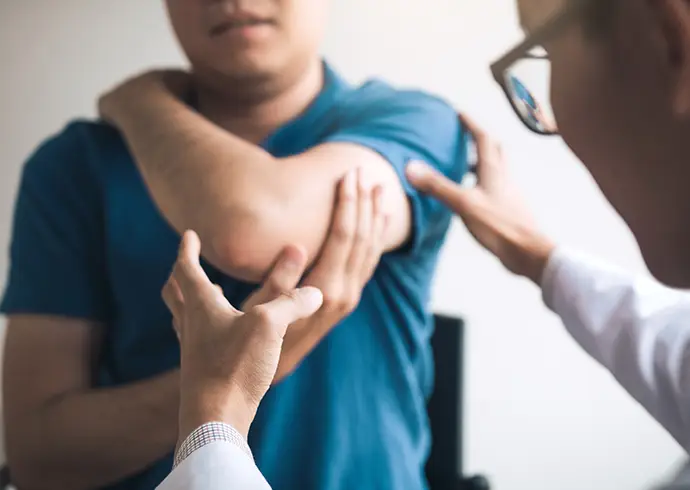 Physical therapists are checking patients elbows at the clinic office room